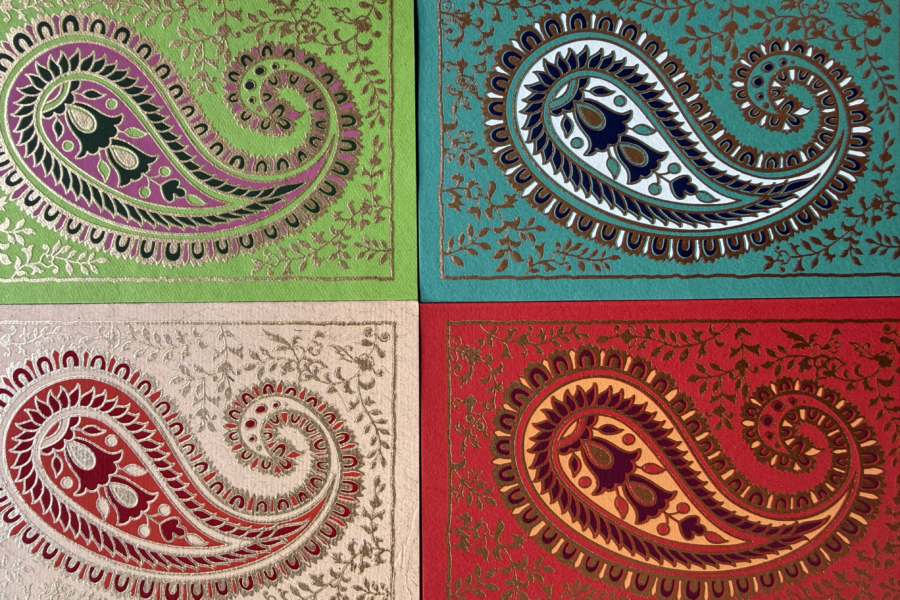 Some South Asian-designed paisley patterns repeated in different colours